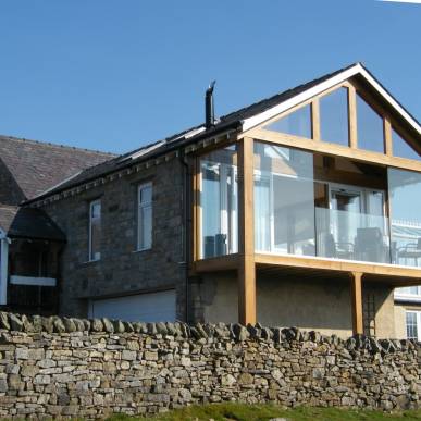 Erect a single storey extension over an existing double garage to create a first floor lounge and sun room - Old School House, Shap, Cumbria